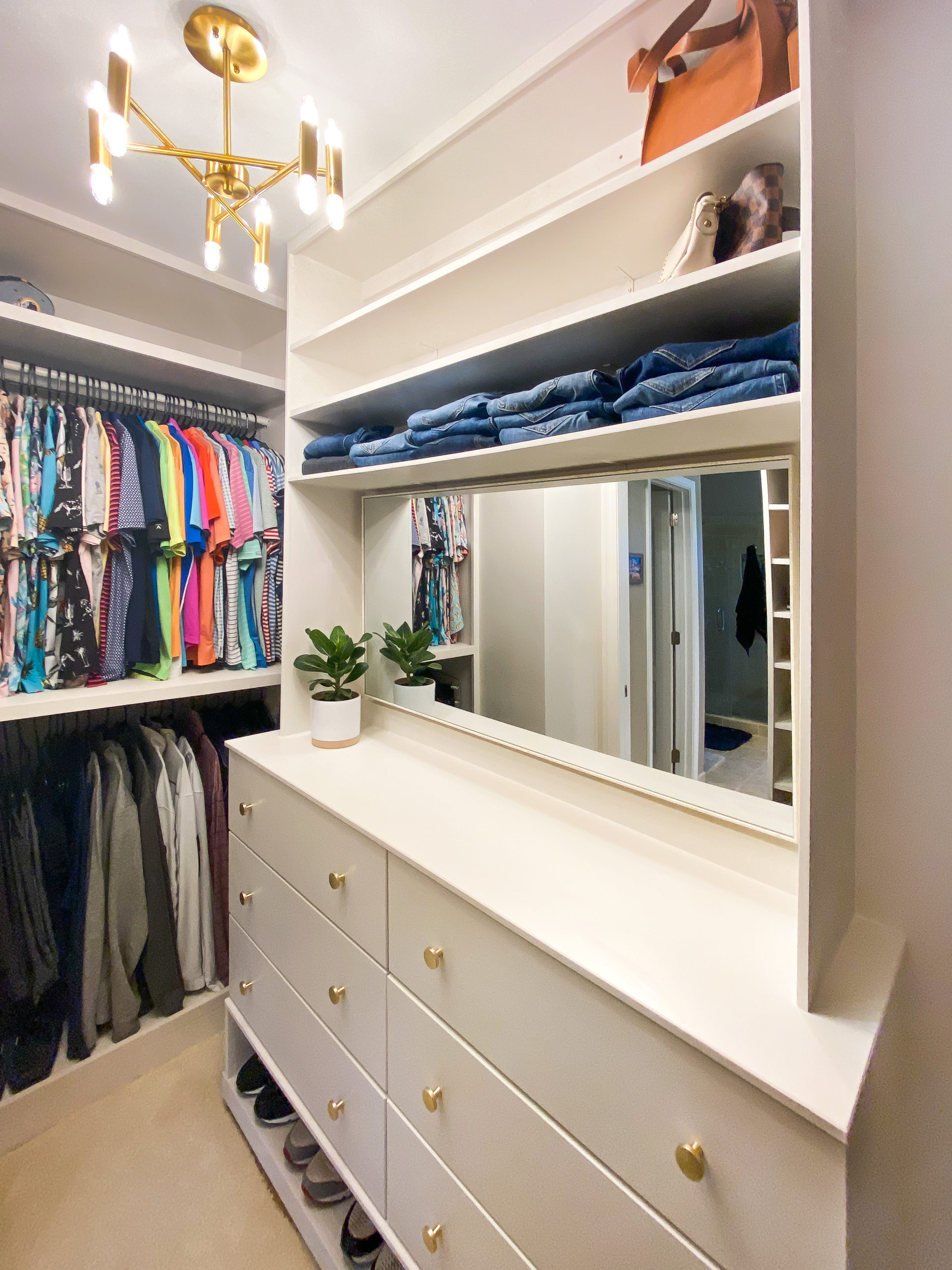 Custom Closet white Built Ins with gold finishes 