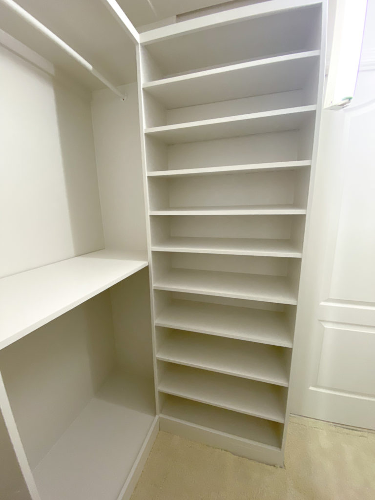 Custom Walk-in Closet Built ins, painted in creamy white.