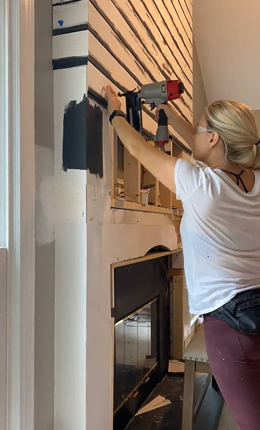 Blonde woman building a DIY Modern Shiplap Fireplace 