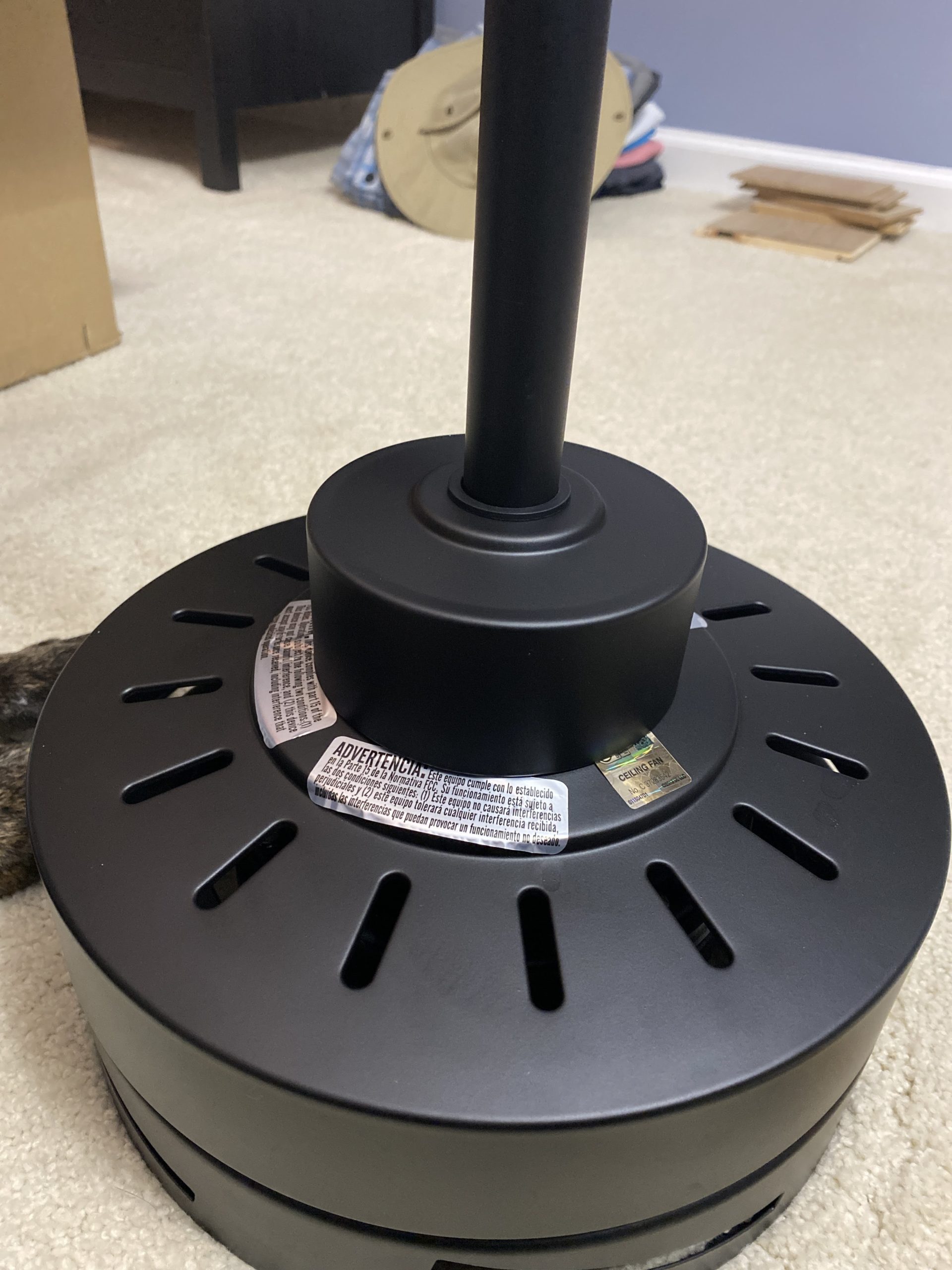 Ceiling Fan Assembly: Feed the coupling cover (covers the top of the motor) over the downrod