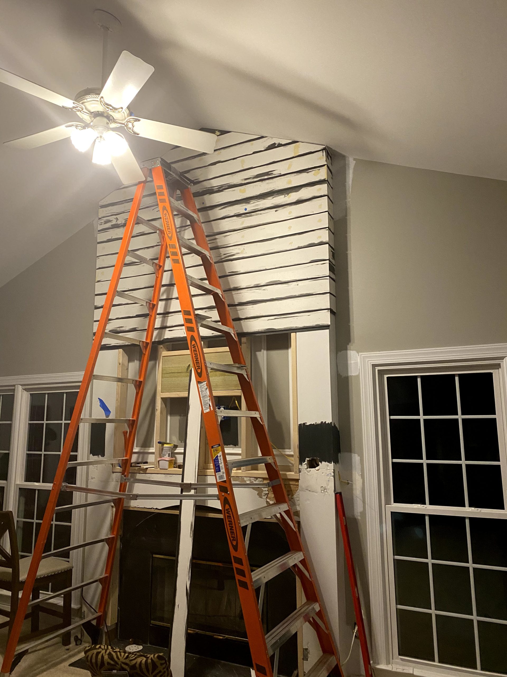 DIY Modern Shiplap Fireplace primed, ready to be painted