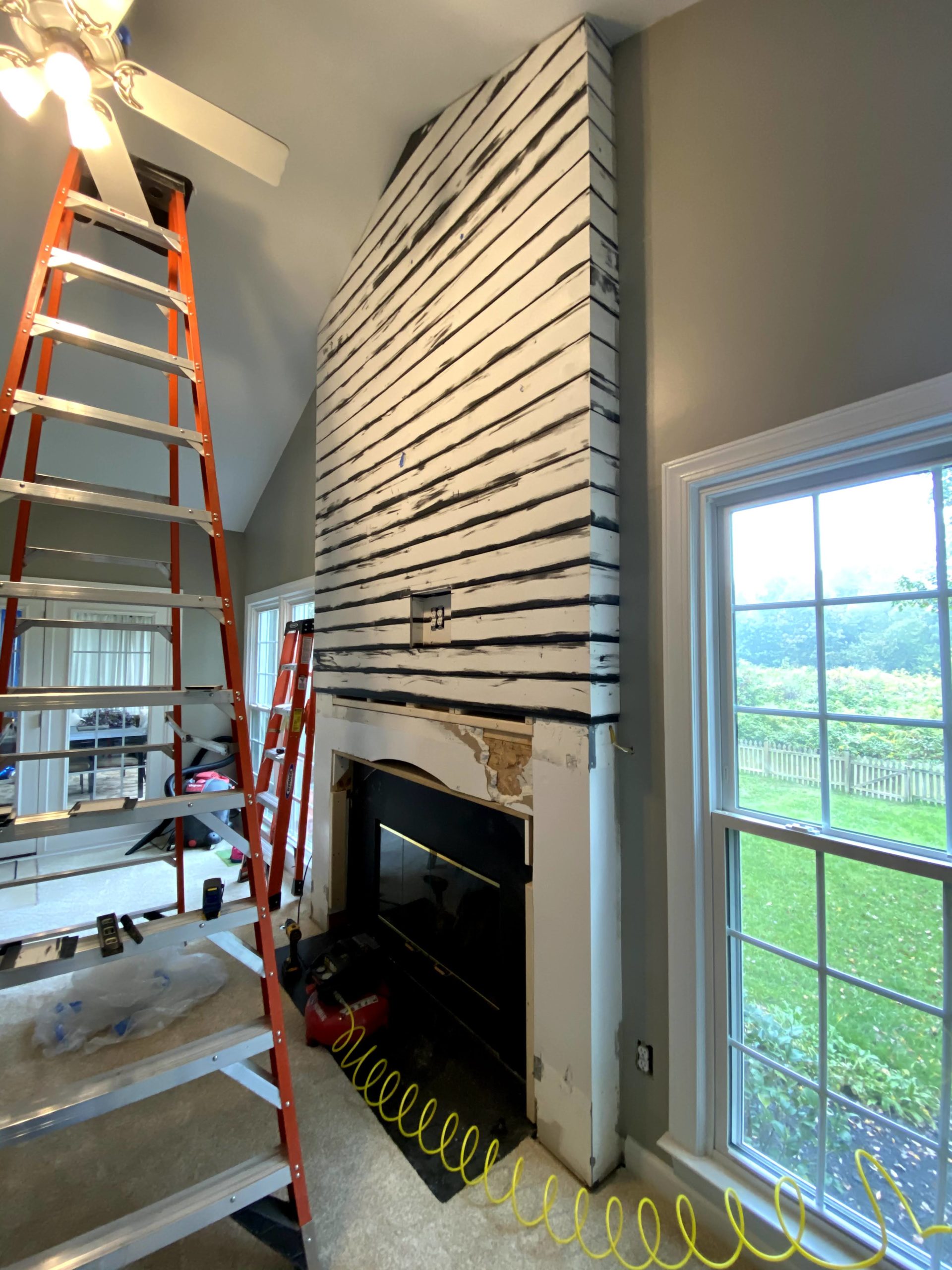 DIY Modern Shiplap Fireplace primed, ready to be painted